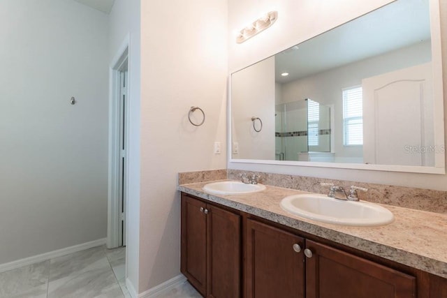 bathroom featuring vanity and a shower with shower door