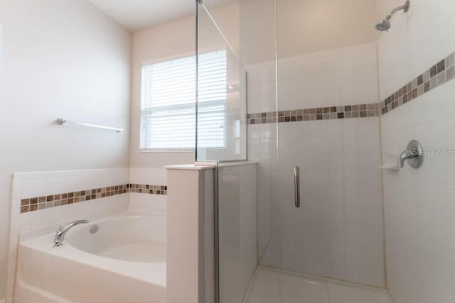 bathroom featuring plus walk in shower