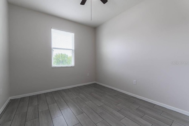 unfurnished room featuring hardwood / wood-style floors and ceiling fan