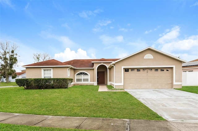 ranch-style house with a garage and a front yard