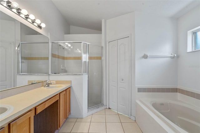 bathroom with tile patterned flooring, vanity, and plus walk in shower