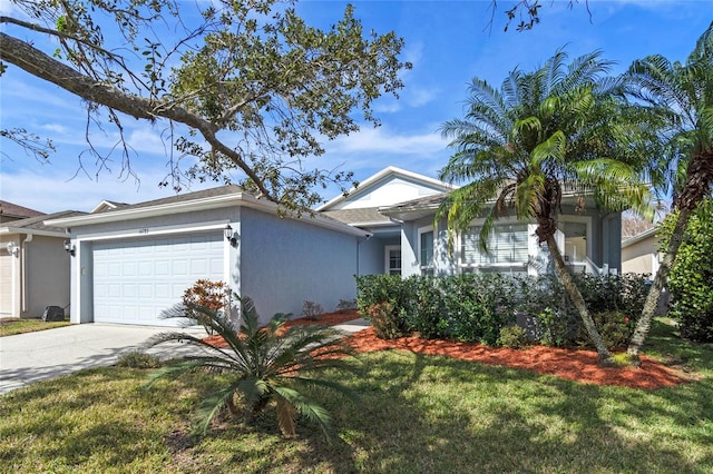 view of front of property featuring a garage and a front lawn