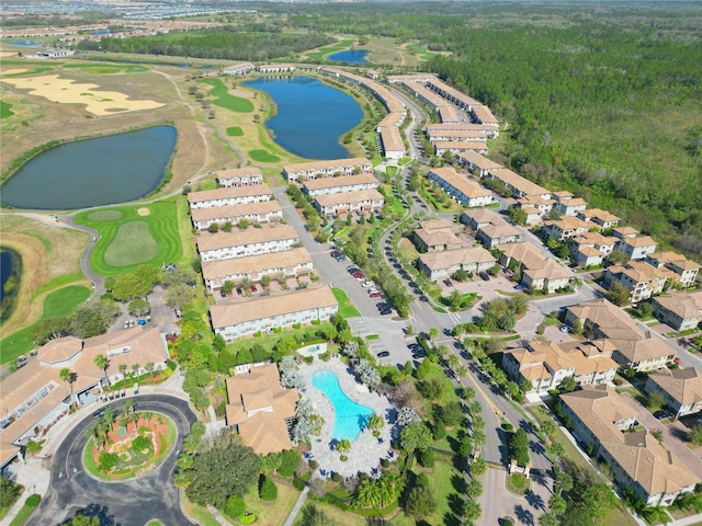 bird's eye view featuring view of golf course, a water view, and a residential view