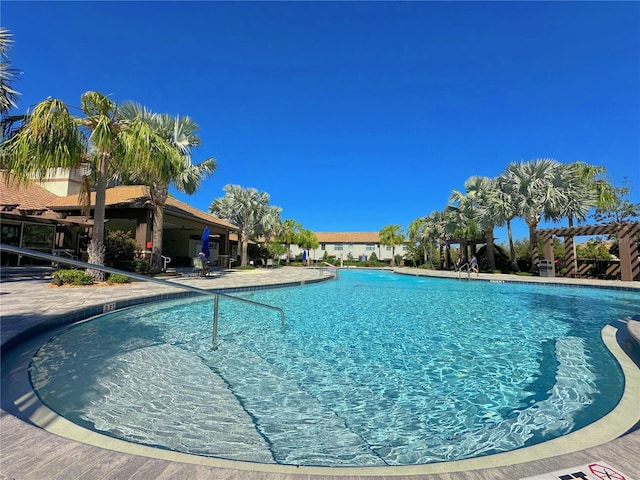 community pool with a patio area