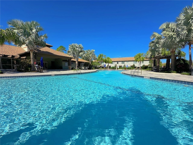 community pool featuring a patio area