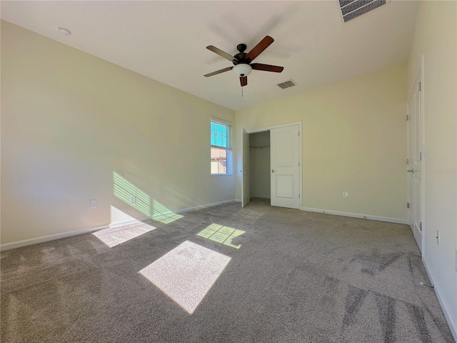 unfurnished bedroom with carpet floors, visible vents, and baseboards