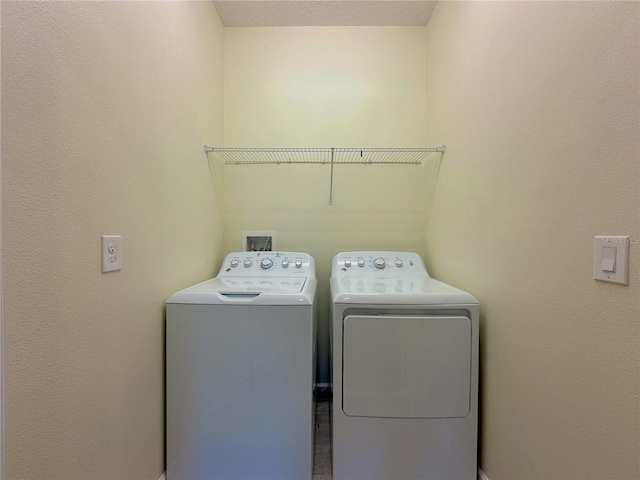 washroom with laundry area and washer and clothes dryer