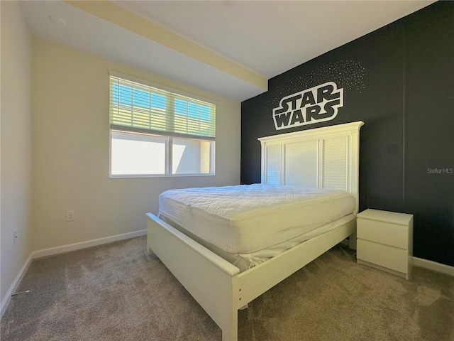 bedroom featuring carpet and baseboards