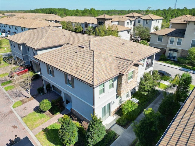 birds eye view of property with a residential view