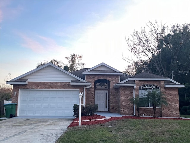 ranch-style house featuring a garage and a front yard