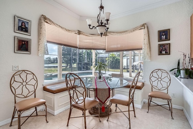 dining space featuring crown molding, a chandelier, and light tile patterned flooring