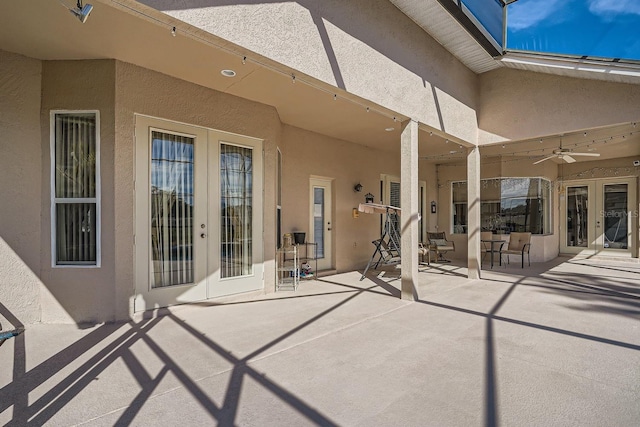 view of patio with french doors and ceiling fan