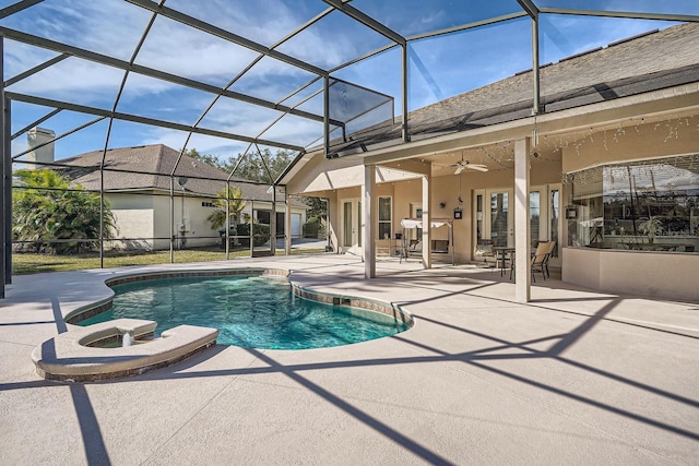 view of pool featuring ceiling fan, a lanai, and a patio area