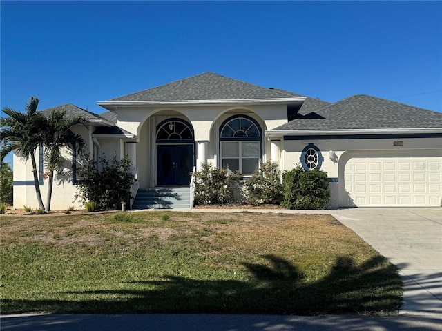 view of front facade featuring a garage and a front yard