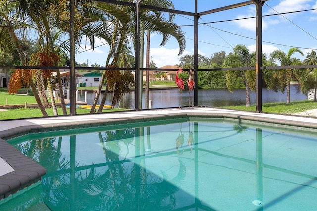 view of swimming pool featuring a lanai and a water view