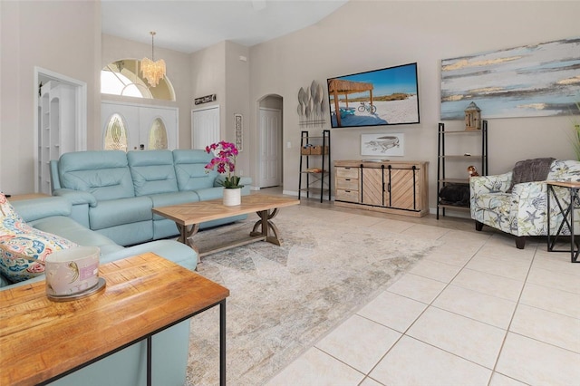 living room featuring tile patterned flooring and a towering ceiling