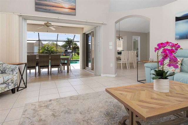 tiled living room with ceiling fan