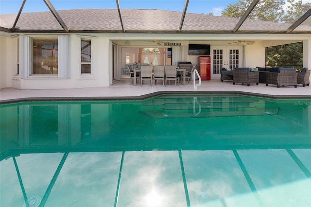 view of pool with an outdoor hangout area, french doors, ceiling fan, and a patio area