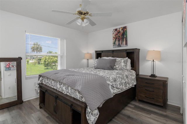 bedroom featuring dark wood-type flooring and ceiling fan