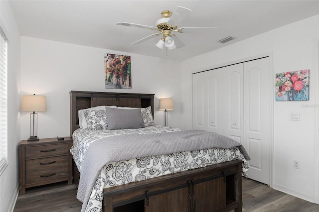 bedroom featuring dark hardwood / wood-style flooring, a closet, and ceiling fan