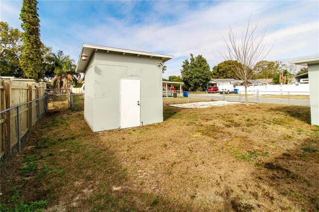 view of shed with fence private yard