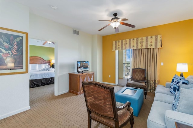 living room featuring light colored carpet and ceiling fan