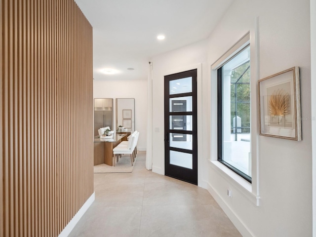 corridor with light tile patterned floors