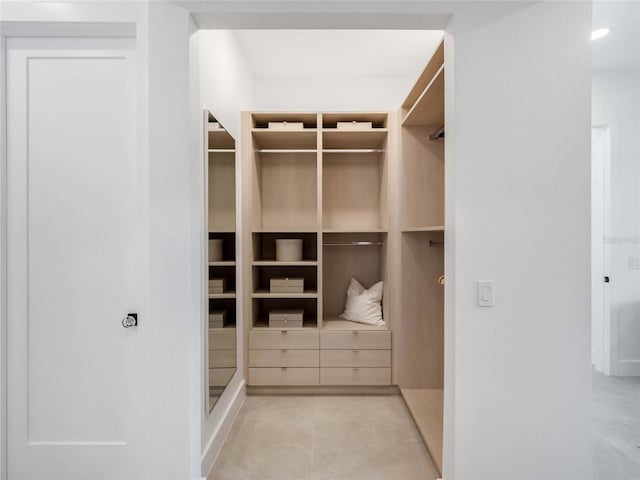 spacious closet with light tile patterned flooring