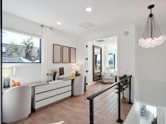 interior space featuring plenty of natural light and light hardwood / wood-style floors