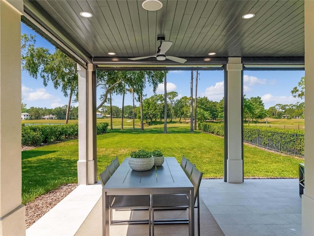 view of patio featuring ceiling fan