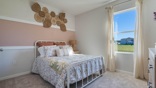 bedroom with light colored carpet