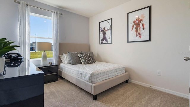 bedroom featuring light colored carpet