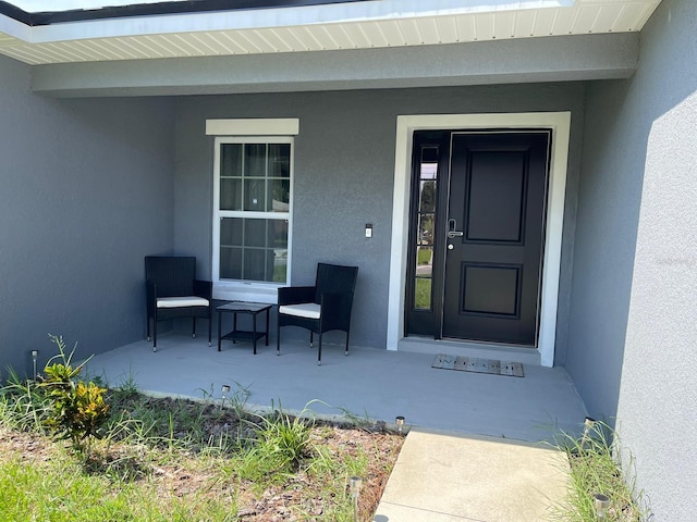 entrance to property with covered porch