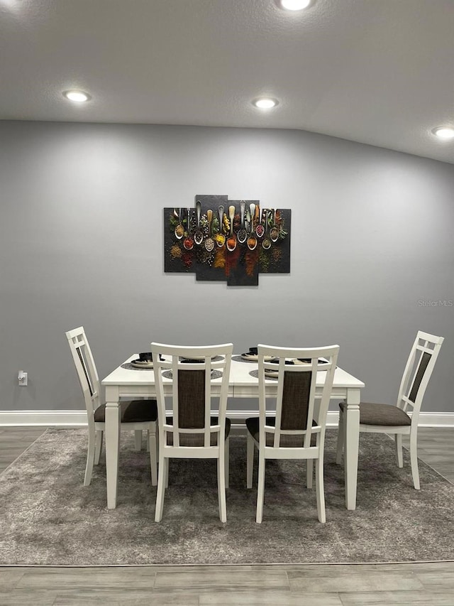 dining space featuring hardwood / wood-style floors