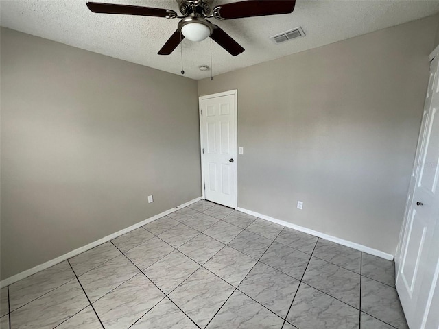 empty room with a textured ceiling