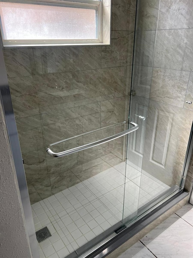 bathroom with an enclosed shower