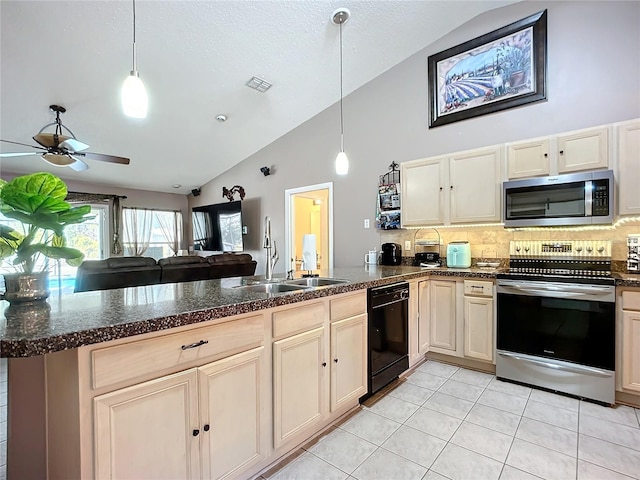 kitchen with sink, kitchen peninsula, pendant lighting, stainless steel appliances, and backsplash