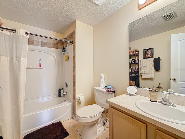 full bathroom with vanity, shower / tub combo, toilet, tile patterned floors, and a textured ceiling