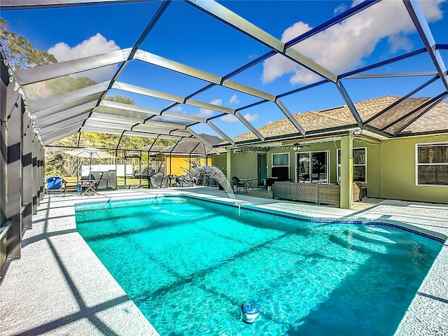 view of swimming pool with a lanai, an outdoor hangout area, and a patio