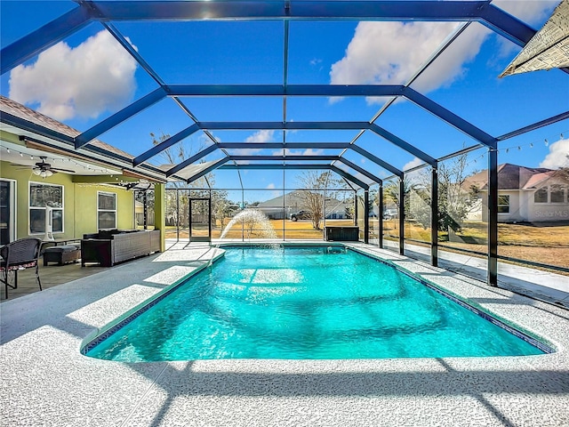 view of pool featuring an outdoor living space, a patio, and glass enclosure