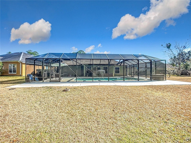 exterior space with a pool, a yard, and a patio