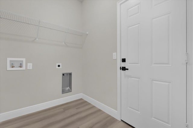 washroom featuring hookup for a washing machine, light wood-style flooring, electric dryer hookup, laundry area, and baseboards