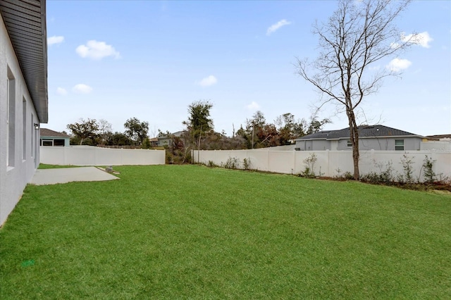 view of yard with a fenced backyard and a patio