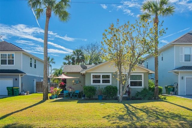 front of property featuring a garage and a front lawn