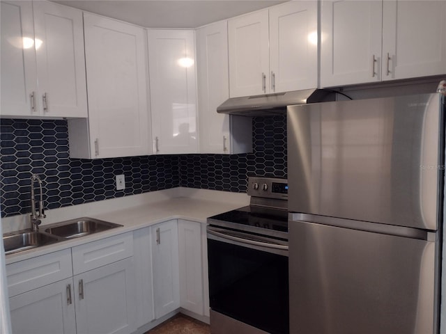 kitchen featuring white cabinets, stainless steel appliances, sink, and backsplash