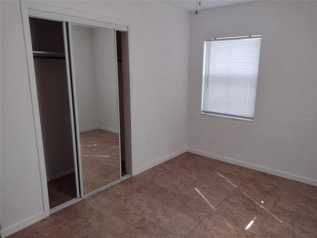 unfurnished bedroom with a closet