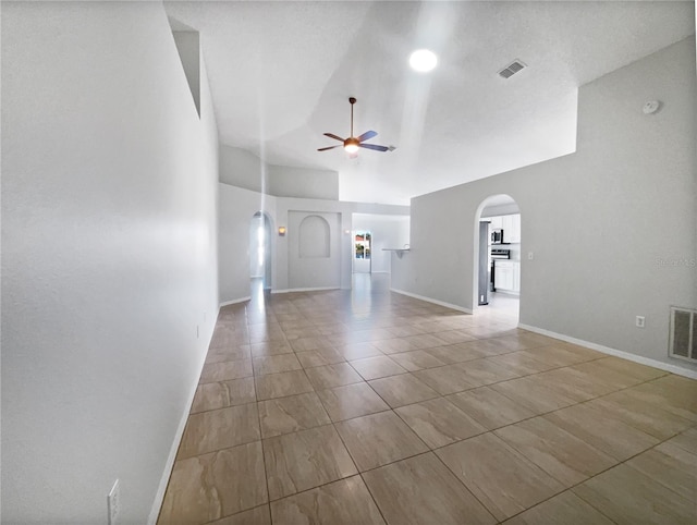 unfurnished living room with vaulted ceiling and ceiling fan