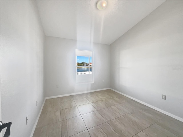 unfurnished room featuring light tile patterned floors