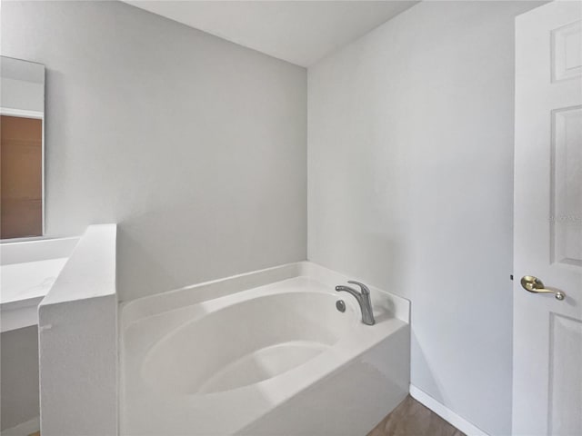 bathroom featuring a tub to relax in