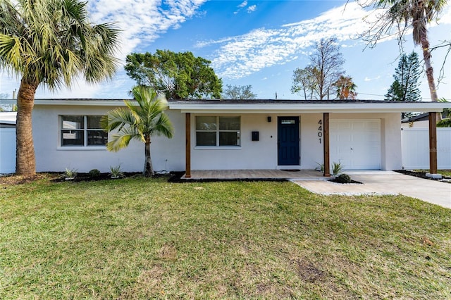 single story home featuring a garage and a front yard